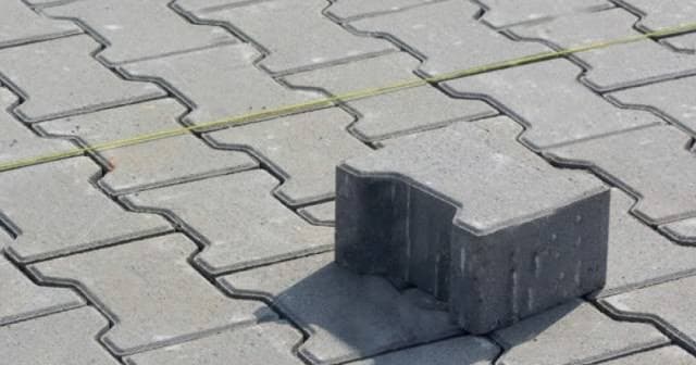 MuDacle physical interlocking paving block sample made from recycled pure water sachets